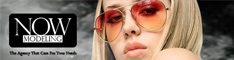 NOW MODELING logo beside a blonde model wearing red sunglasses with a dark background.